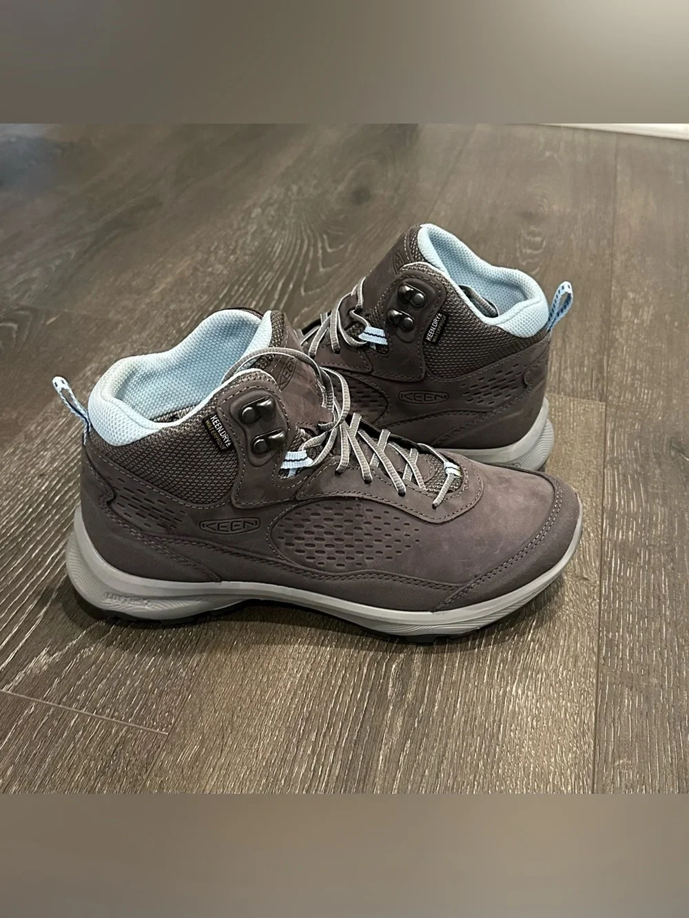 KEEN Gray Lace-Up Women's Hiking Boots with Light Blue Lining.